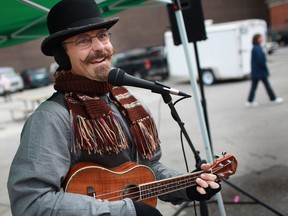 Matthew Romain entertains the crowd with a ukulele on the last day of the season for the Downtown Farmers' Market in Windsor on Saturday, Oct. 6, 2012. (DAX MELMER/The Windsor Star)
