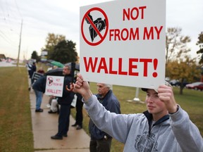 In this file photo, Matthew Charbonneau, 18, participates in a demonstration protesting the funding of abortions while outside the office of MPP Dwight Duncan on Lauzon Parkway Saturday, Oct. 13, 2012. (DAX MELMER/The Windsor Star)
