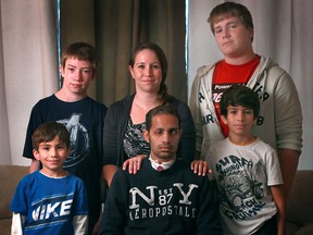 The Rocha family, (top, left to right) Ethan, Melissa, Devlin, (bottom, left to right), Cameron, Alex and Braden, are pictured at their home, Saturday, Oct. 13, 2012.  A fundraiser is being held to help with Alex's treatment after he had a brain tumour removed. (DAX MELMER/The Windsor Star)