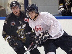 LaSalle's Austin Fontaine, left, battles Leamington's Bryce Doan in pre-season action at the Vollmer Centre. (NICK BRANCACCIO/The Windsor Star)