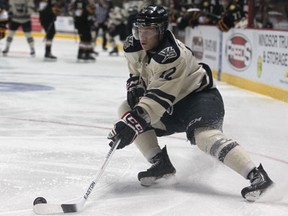 Windsor's Ben Johnson handles the puck in the Sarnia zone Monday at the WFCU Centre. (DAX MELMER/The Windsor Star)