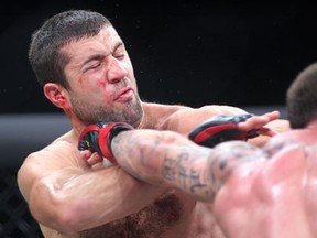 Windsor's Ali Mokdad takes a punch against Simon Marini of Hamilton in Bellator 76 at Caesars Friday. (NICK BRANCACCIO/The Windsor Star)