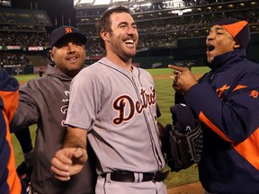 Detroit pitcher Justin Verlander is congratulated by teammates after the Tigers beat the Athletics 6-0 in Game 5 in Oakland, (Ezra Shaw/Getty Images)
