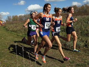 Massey's Fiona Rocheleau, from left, Brianne Bracci and Olivia Little compete at the WECSSAA cross-country meet at Malden Park in Windsor Thursday.  (TYLER BROWNBRIDGE/The Windsor Star)