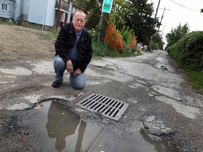 City councillor Hilary Payne is photographed in an alley off Erie Street in Windsor, Ont. on Tuesday, October 2, 2012. Payne is concerned over the expected costs to fix aging alleyways.  (TYLER BROWNBRIDGE / The Windsor Star)