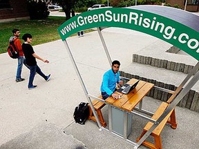 In this file photo, University of Windsor chemistry student Abdullah Allawnha uses GreenSunRising solar recharging station near the Leddy Library Wednesday September 26, 2012. (NICK BRANCACCIO/The Windsor Star)