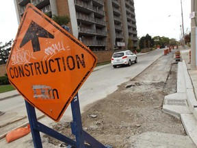 Watermain work continues on Caron Avenue in Windsor, Ont. on Wednesday, October 3, 2012. The intersection of Riverside Drive and Caron will be closed Thursday for emergency repairs.  (TYLER BROWNBRIDGE / The Windsor Star)