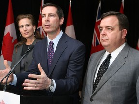 Dalton McGuinty is flanked by Sandra Pupatello and Dwight Duncan in this file photo.