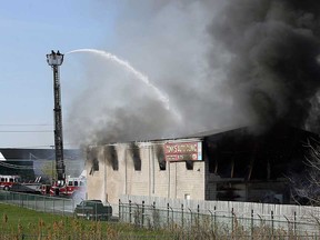 In this file photo, firefighters battle a blaze at a auto repair shop near the corner of Tecumseh Road and Banwell Road in Windsor on Monday, April 12, 2010. The fire, which destroyed the building, is under investigation.        (TYLER BROWNBRIDGE / The Windsor Star)