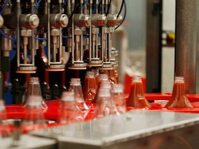 In this 2009 file photo, ketchup bottles are filled  at the  H.J. Heinz Ltd. plant in Leamington, Ont.  (JASON KRYK/ THE WINDSOR STAR