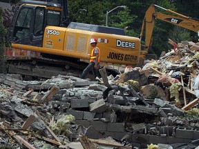 In this file photo, workers with Jones Group demolish homes on Bethlehem Street near Spring Garden Road in Windsor, Ont., Thursday August 4,  2011. (NICK BRANCACCIO/The Windsor Star)
