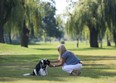 In this file photo, Kim Lansens plays fetch with her dog Snoopy at the former Lakewood Golf course in Tecumseh, Ont. The municipality is seeking input on the development of the former golf course.  (DAN JANISSE/ The Windsor Star)