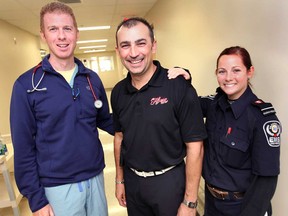 Leamington Flyer assistant coach Jamie McDermott, centre,  poses Monday, Oct.1, 2012, at the Leamington District Memorial Hospital with Dr. Rob Stapleton and paramedic Stacey Feurth. McDermott recognized the many staff members at the hospital for helping save his life this past March when he suffered a ruptured aortic aneurysm. (DAN JANISSE/The Windsor Star)