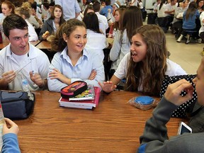 Students Aaron Marentette, left, Taylor Jones and Melissa Montaleone  take part in the Mix it up Lunch at Villanova high school in LaSalle, Ont., on Tuesday, October 30, 2012. The projects asked students to sit and talk with someone they didn't know over the lunch hour.              (TYLER BROWNBRIDGE / The Windsor Star)