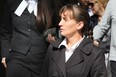 Former Walmart employee Meredith Boucher, centre, walks out of Superior Court of Justice during the first day of a civil trial by jury Monday September 24, 2012. (Nick Brancaccio/The Windsor Star)