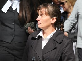 Former Walmart employee Meredith Boucher, centre, walks out of Superior Court of Justice during the first day of a civil trial by jury Monday September 24, 2012. (Nick Brancaccio/The Windsor Star)