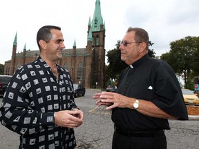 In this file photo, Father William Riegel, right,and  local businessman Al Quesnell stand in front of historic Assumption Church in Windsor on Oct. 3, 2012.  Quesnel has upped his challenge pledge by $3.5 million.(NICK BRANCACCIO/The Windsor Star)