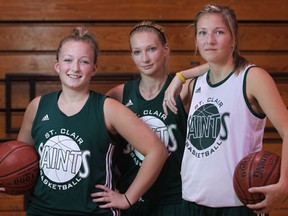 St. Clair sisters Katie Rizea, from left, Kendyl Rizea and Kelly Rizea are members of the St. Clair women's basketball team. (DAX MELMER/The Windsor Star)