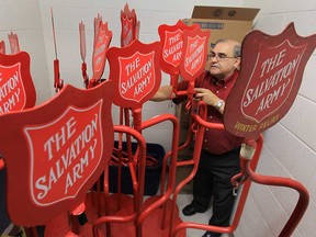 Joe Peterson, co-ordinator of the local Salvation Army Christmas kettle campaign, sorts through some equipment Monday, Oct. 29, 2012, at the Windsor, Ont. location. The organization is looking for volunteers to help with the campaign.  (DAN JANISSE/The Windsor Star)