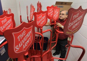 Joe Peterson, co-ordinator of the local Salvation Army Christmas kettle campaign, sorts through some equipment Monday, Oct. 29, 2012, at the Windsor, Ont. location. The organization is looking for volunteers to help with the campaign.  (DAN JANISSE/The Windsor Star)