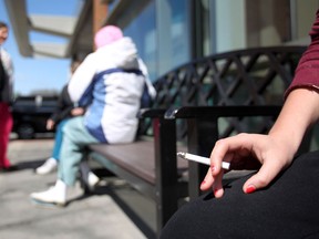 A woman smokes in this file photo. (Dax Melmer/The Windsor Star)