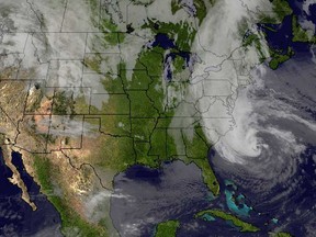 This image obtained on October 28, 2012 from the University of Wisconsin's Space Science and Engineering Center, shows Hurricane Sandy off the U.S. East coast. U.S. emergency officials braced for the potentially massive impact of a so-called "Frankenstorm" Sunday as Hurricane Sandy lumbered north in the Atlantic Ocean, poised to hit the eastern seaboard with torrential rains and gale-force winds. The superstorm was expected to make landfall somewhere between Virginia and Massachusetts early Tuesday. (HO/AFP/Getty Images)