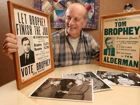 Tom Brophey was Windsor's shortest serving mayor and remained in office for a mere eight days. In 1950, Brophey lost in a recount to Art Reaume.  In this 2006 file photo, his son Tom Brophey looks through memorabilia pertaining to Brophey's run at the mayorship.  (The Windsor Star/Scott Webster)