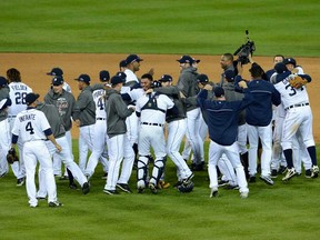 The Detroit Tigers celebrate on the field after they won 8-1 against the New York Yankees during game four of the American League Championship Series at Comerica Park on October 18, 2012 in Detroit.  (Photo by Jason Miller/Getty Images)