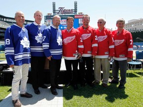 In this file photo, former Toronto Maple Leafs players from left Jim McKenny, Kevin Maguire and Wendel Clark stand with former Detroit Red Wings players Dino Ciccarelli, Joe Kocur, Alex Delvecchio and Ted Linsday during a news conference, during a news conference at Comerica Park in Detroit, Wednesday, July 11, 2012, annoucing the preliminary rosters for the Toronto Maple Leafs-Detroit Red Wings Alumni Showdown hockey game on Dec. 31, 2012. (AP Photo/Paul Sancya)