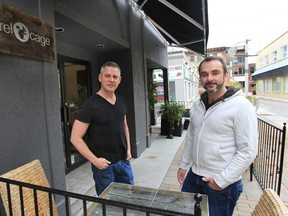 John Ansell, right, and Steven Thompson, owners of the Squirrel Cage cafe, are pictured Tuesday, Oct. 30, 2012, on the patio of their Maiden Lane establishment in Windsor. (DAN JANISSE/The Windsor Star)