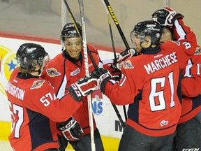 Windsor's Jordan McNaughton, rom left, Josh Ho-Sang, Chris Marchese and Kerby Rychel celebrate one of two goals by Rychel Saturday in Erie. (Janet Kummerer/Erie Times-News)