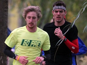 St. Clair's Andrew DeGroot, right, finished in second place at the OCAA cross-country championships in the Soo Saturday. (NICK BRANCACCIO/The Windsor Star)