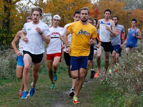 University of Windsor runners Mathew Walters, left, and Fraser Kegel, front right, lead the Lancers' cross-country team at Malden Park Monday. (NICK BRANCACCIO/The Windsor Star)