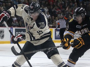 Windsor's Brady Vail, left, is checked by Sarnia's Jack Kuzmyk at the WFCU Centre. (DAX MELMER/The Windsor Star)