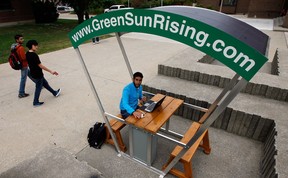 University of Windsor chemistry student Abdullah Allawnha uses GreenSunRising solar recharging station near the Leddy Library Wednesday September 26, 2012. (NICK BRANCACCIO/The Windsor Star)