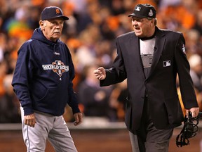 Home plate umpire Gerry Davis, right, talks with Tigers manager Jim Leyland during Game 1 of the World Series. (Christian Petersen/Getty Images)