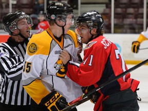 Windsor's Derek Schoenmakers, right, battles Sarnia's Connor Murphy during the Spits' 5-2 loss at the RBC Centre in Sarnia Thursday. (Metcalfe Photography)