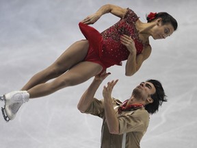 Canadians Meagan Duhamel, top, and Eric Radford are in second place after the pairs short program during Skate Canada International at the WFCU Centre. (JASON KRYK/The Windsor Star)