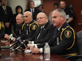 Right to left: New Windsor Police  deputy chief of operations Vince Power, OPP Insp. Rick Derus -currently head of the Essex OPP,  who will become deputy chief of administration in November,  Windsor Police chief Al Frederick, and retiring deputy chief Jerome Brannigan during an afternoon press conference at Windsor Police Headquarters on October 11, 2012. (JASON KRYK/ The Windsor Star)
