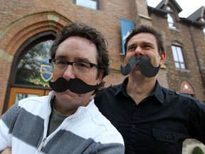 Steve Fields, left, and team captain Phil Graniero at the University of Windsor are hoping to make their cut-out moustaches unnecessary as they prepare for Movember,  October 30, 2012.  (NICK BRANCACCIO/The Windsor Star)