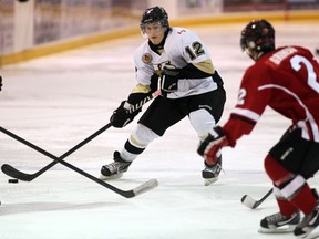 LaSalle's Blake Jones, left, is checked by Leamington's J.P. Grineau at the Vollmer Centre. (NICK BRANCACCIO/The Windsor Star)