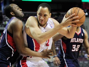 Pistons forward Tayshaun Prince, right, is guarded by Atlanta's James Anderson during a pre-season game at the Palace of Auburn Hills. (AP Photo/Carlos Osorio)