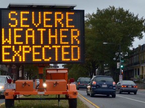 A wind warning has been issued for Windsor and Essex County. A road sign warns drivers of severe weather in downtown Washington, D.C. on Oct. 28, 2012. (Eva HAMBACHEVA HAMBACH/AFP/Getty Images)