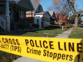 Yellow police tape surrounds the scene where a man was assaulted with a baseball bat in the 700 block of Brock Street in Windsor, Ont., Sunday, Oct. 21, 2012.  (DAX MELMER/The Windsor Star)