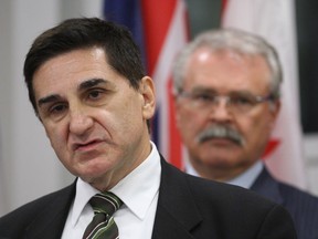 Canadian Food Inspection Agency president George Da Pont, left,  gives an update on the beef recall situation at a news conference in Ottawa on October 4, 2012. Agriculture Minister Gerry Ritz looks on.  THE CANADIAN PRESS/Adrian Wyld