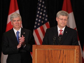 Michigan's Governor Rick Snyder and Prime Minister Stephen Harper (right) announce a new bridge to be built between Windsor and Detroit at the Hilton Hotel in Windsor on Friday, June 15, 2012.         (Windsor Star / TYLER BROWNBRIDGE)