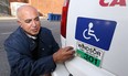 Taxi owner operator Bouda Binaei with his wheelchair accessible taxi Thursday October 18, 2012. (NICK BRANCACCIO/The Windsor Star)