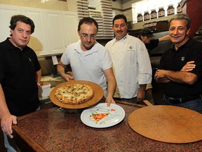 Mauro Chechi, left, Remo Tortola, chef Steven Ward and Giano Piazza have put out a new book featuring recipes from members of the Caboto Club in Windsor. (TYLER BROWNBRIDGE / The Windsor Star)