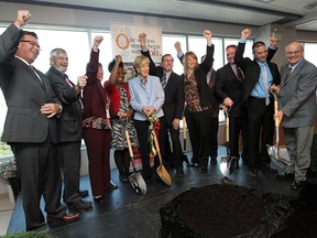 Dot Muzzatti, centre, is surrounded by dignitaries during a groundbreaking ceremony at the CAS offices in Windsor on Friday, October 12, 2012. The Muzzatti family donated $1.25 million to build a new building. (TYLER BROWNBRIDGE / The Windsor Star)