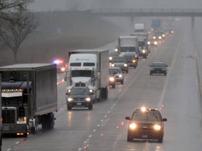 File shot of the OPP blocking  the eastbound lanes of the 401 near Puce Road following a single-vehicle car accident during slippery road conditions on March 30, 2012 in Lakeshoreo.  (JASON KRYK/ The Windsor Star)